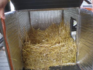 Don’t be shy about using the straw, you can load a lot of straw into the box! It gives the kitties more warmth to nest into.